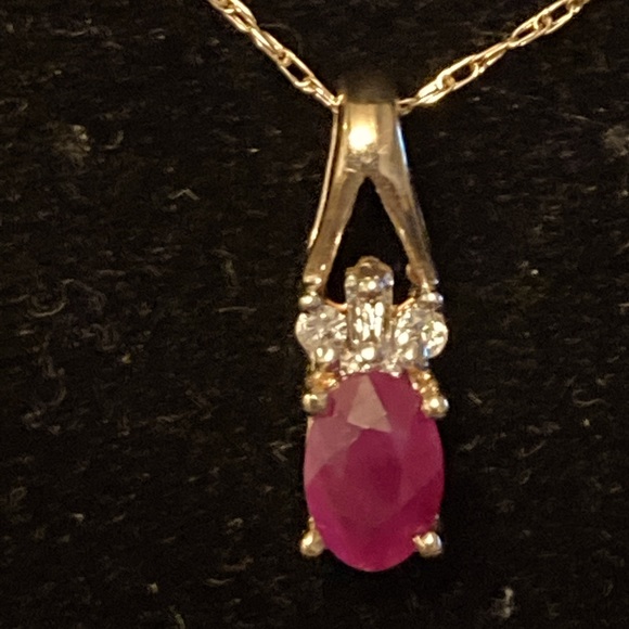 10 Karat ruby and diamond pendant with chain